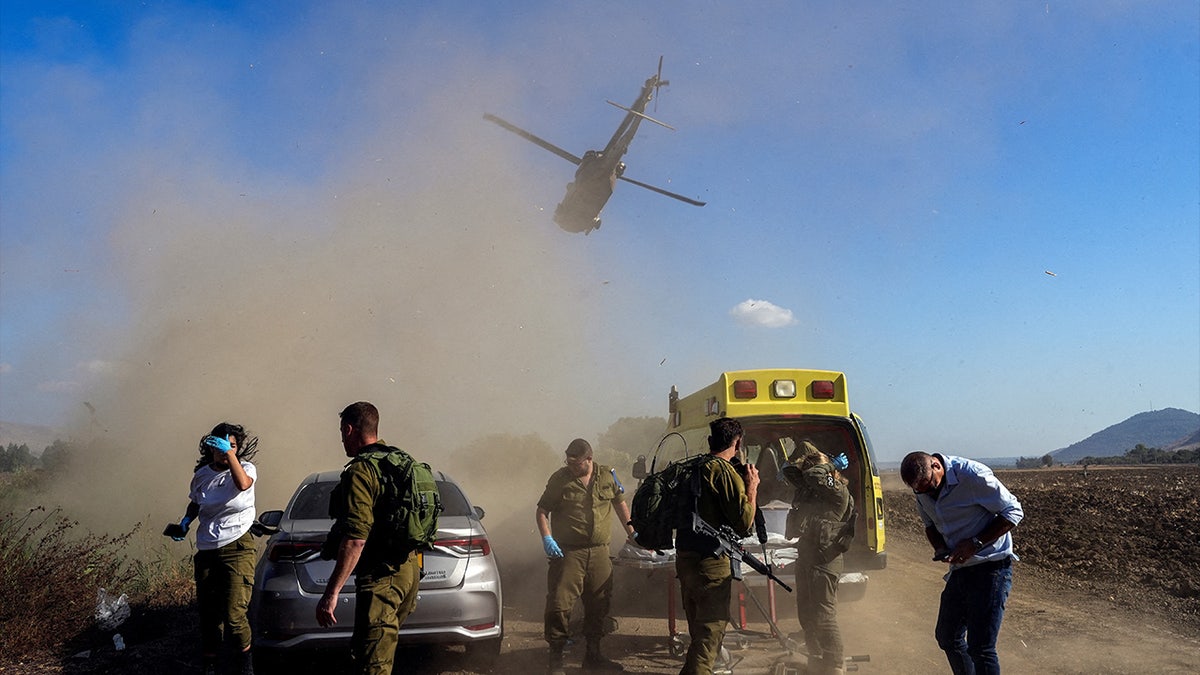 Israeli soldiers evacuate an injured man following a cross-border attack from Lebanon into Israel, on the Israeli side of the border, amid ongoing cross-border hostilities between Hezbollah and Israeli forces on Sept. 1, 2024.