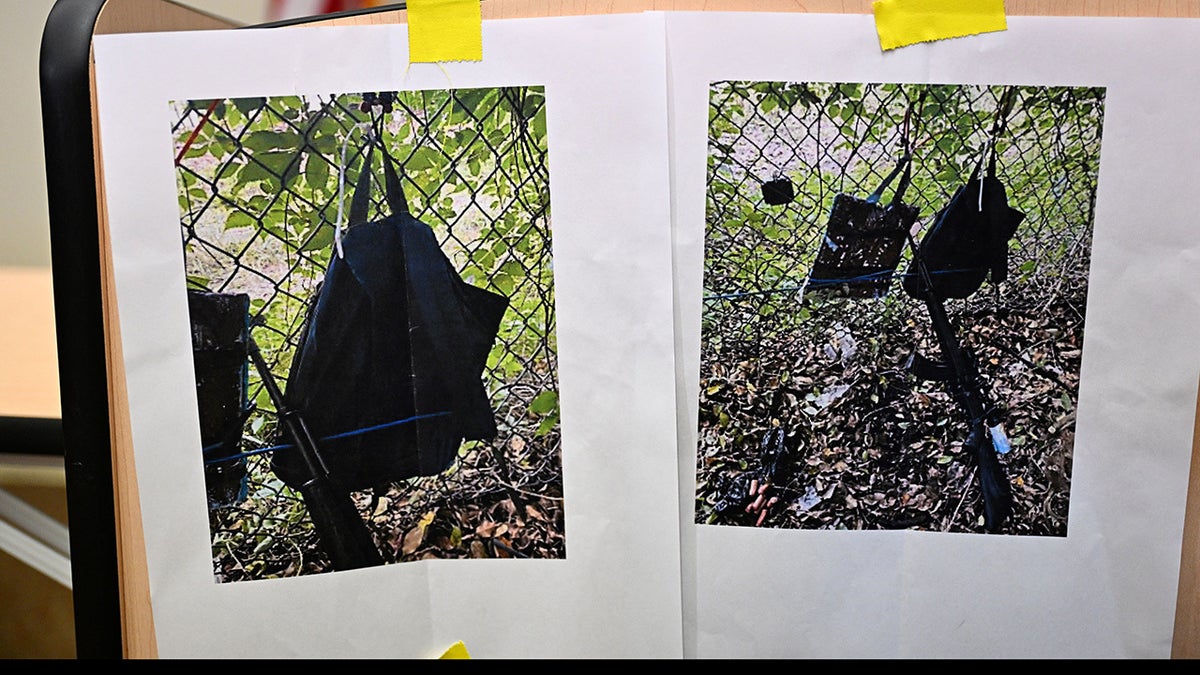 Pictures of evidence found at the fence of former President Donald Trump's golf course are shown at a press conference