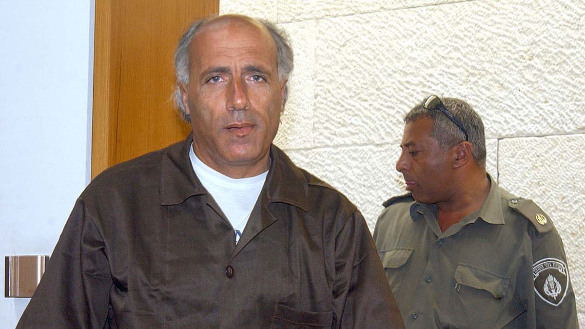 Nuclear whistleblower Mordechai Vanunu appears at the Israeli Supreme Court May 13, 2002, in Jerusalem. Former nuclear technician Vanunu, who is serving an 18-year sentence for treason, asked the court to make public secret documents from his trial and to meet with his British lawyers. Vanunu was sentenced to jail in 1988, two years after he gave The Sunday Times of London pictures of Israel's nuclear reactor near the Negev Desert town of Dimona.