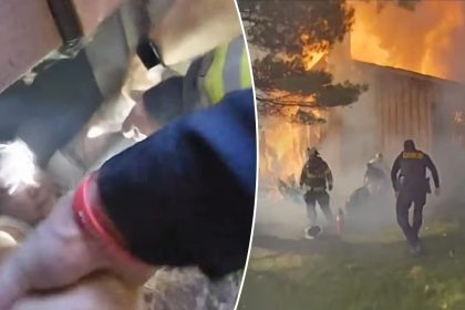 Ohio woman pulled to safety from basement while home above her engulfed in flames, bodycam shows