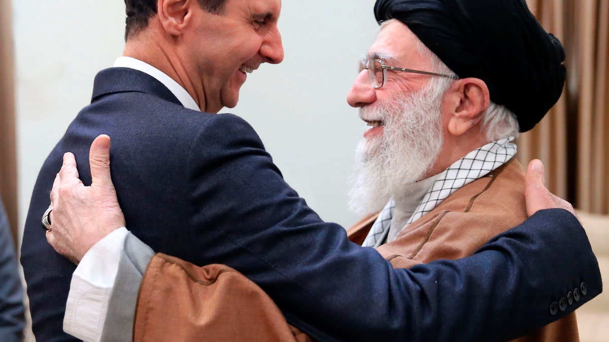 FILE - In this Feb. 25, 2019 file photo, released by an official website of the office of the Iranian supreme leader, Supreme Leader Ayatollah Ali Khamenei, right, greets Syrian President Bashar Assad, in Tehran, Iran. On Nov. 13, 1970, Hafez Assad, a young career air force officer, launched a bloodless coup. Fifty years later, his family still rules Syria. The country is in ruins from a decade of civil war that killed around a half million people, displaced half the population and virtually wiped out the economy. But Hafez’s son, Bashar Assad, has an unquestioned grip on what remains. 