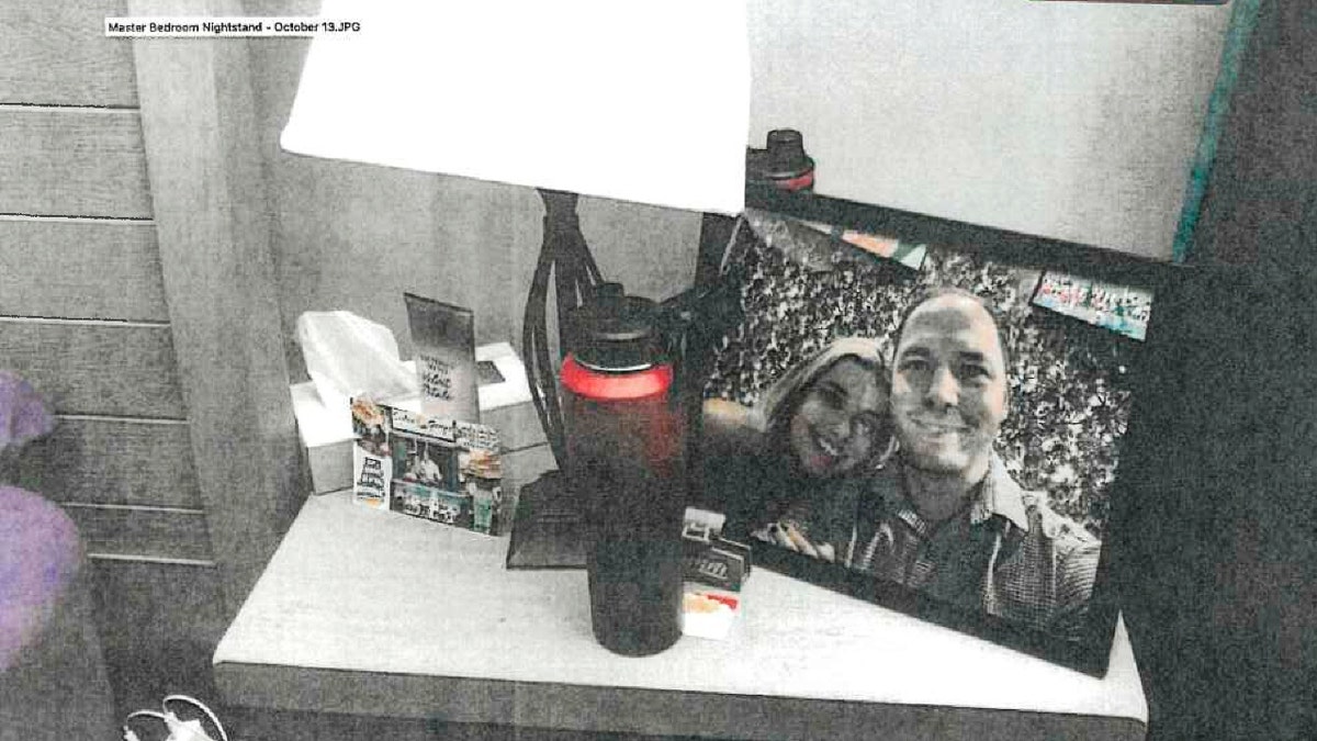 This image provided by the Fairfax County Police Department and taken on Oct. 13, 2023, was submitted as evidence in the murder case against Brendan Banfield shows a framed photo of Banfield and Juliana Peres Magalhães on his bedside table in Herndon, Va.