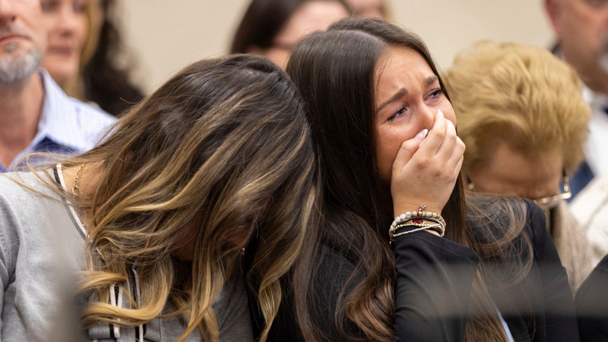 From left, Connolly Huth, roommate of Laken Riley, and Lauren Phillips, Riley's younger sister, become emotional during the trial for Jose Ibarra at the Athens-Clarke County Superior Court on Tuesday, Nov. 19, 2024, in Athens, Ga.