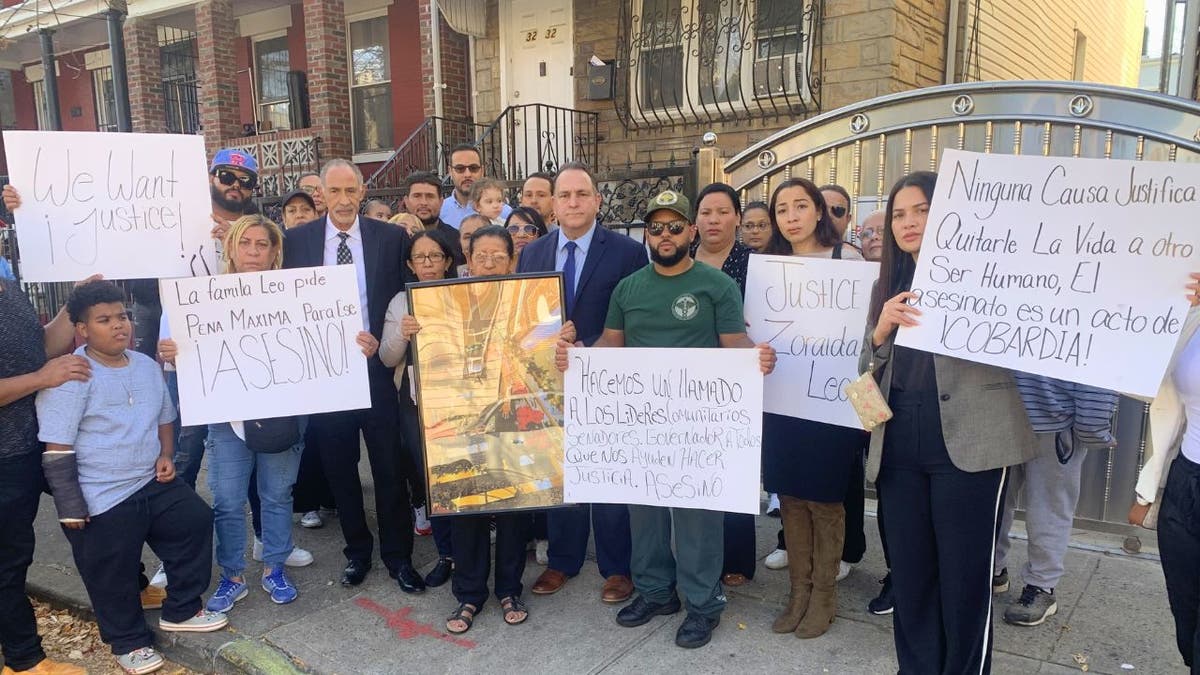 Hiram Monserrate, with the Leo family and local residents