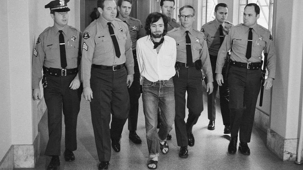 Seven deputies escort Charles Manson from the courtroom after he and three followers were found guilty of seven murders in the Tate-LaBianca slayings.