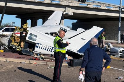 Aftermath of small plane crash onto Texas roadway caught on camera with split fuselage, damaged vehicles