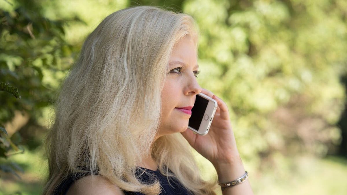 woman talks on phone