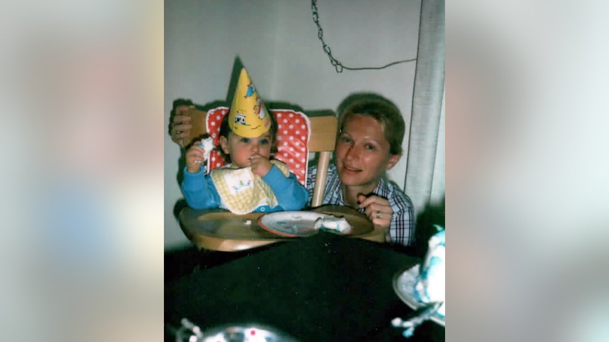 Noreen Boyle kneeling next to her son on his birthday.