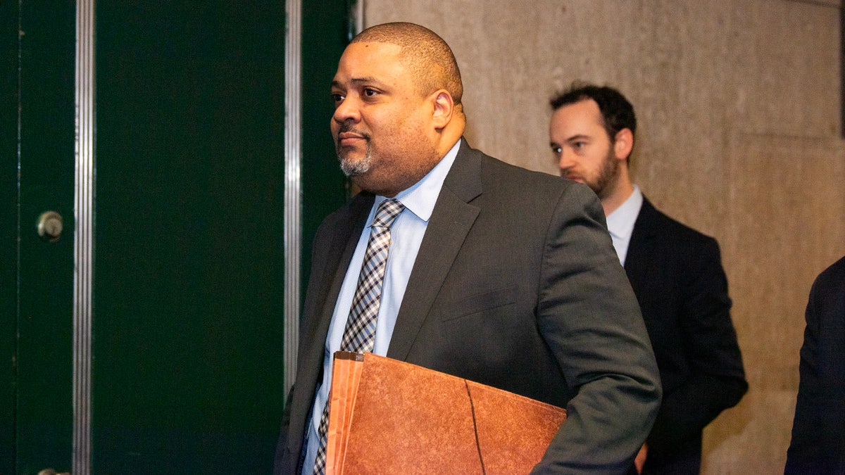 Manhattan District Attorney Alvin Bragg walks in the hallways of Manhattan Supreme Court