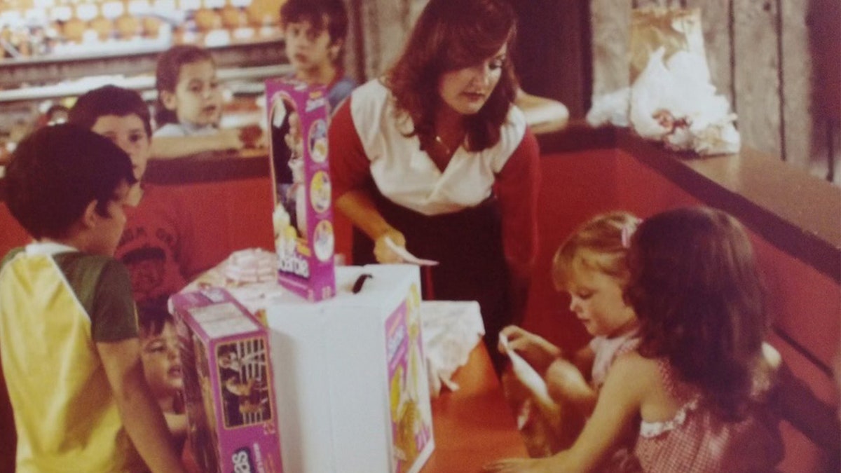 Wanda Holloway looking at her daughter Shanna who is surrounded by presents.