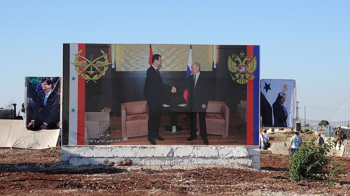 A large poster in the city of Rastan shows the Syrian head of state Bashar al-Assad, left, and Russian President Vladimir Putin as allies.