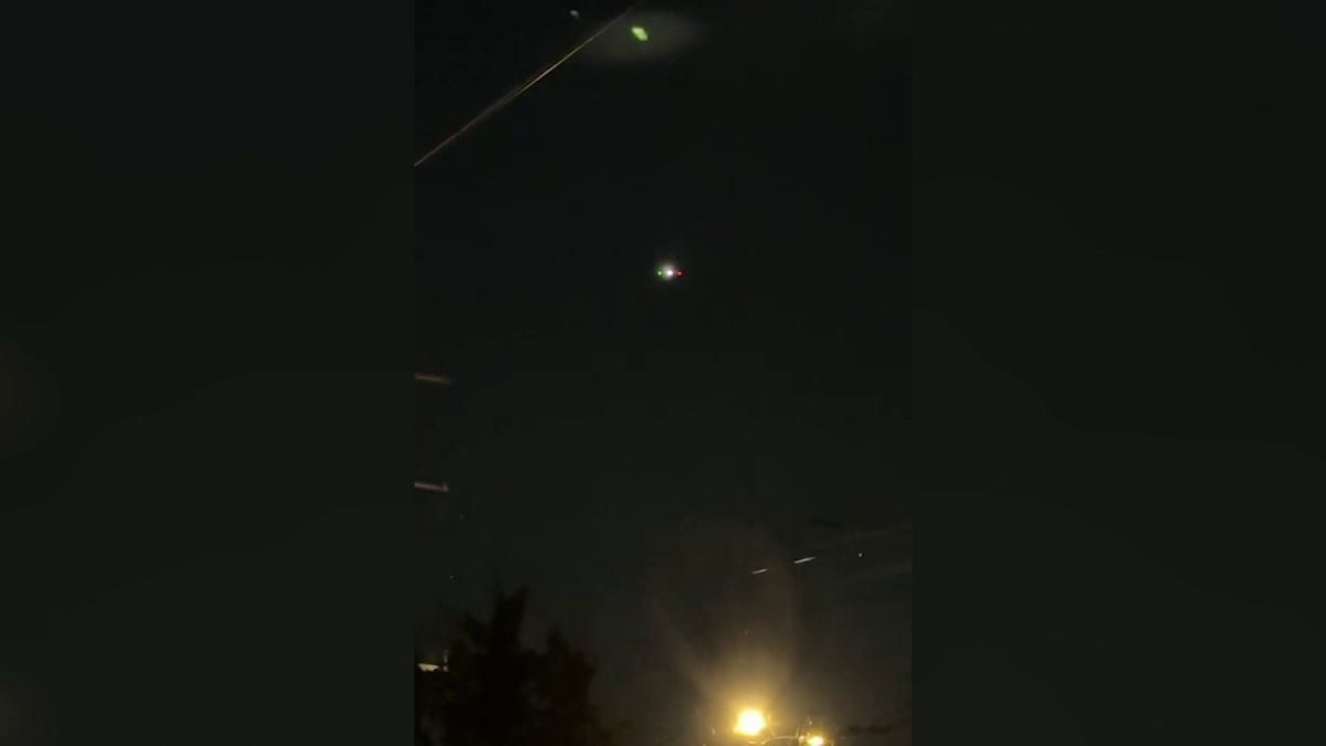 what are thought to be drones in night sky in user photo