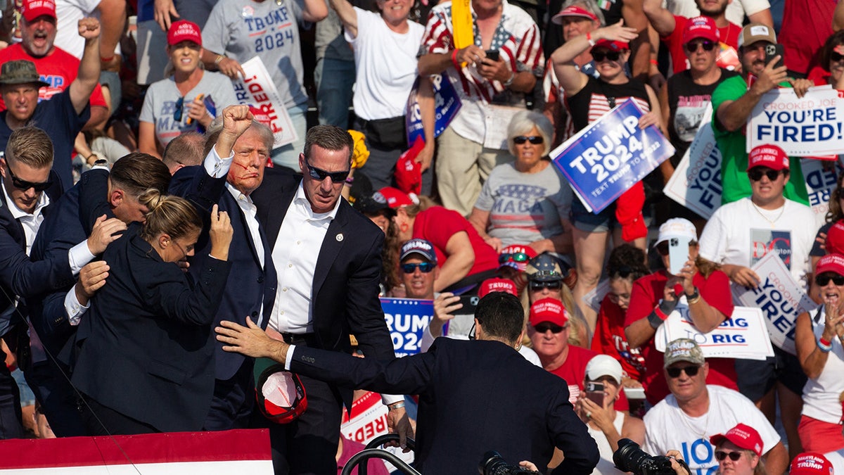 Donald Trump surrounded by Secret Service after assassination attempt