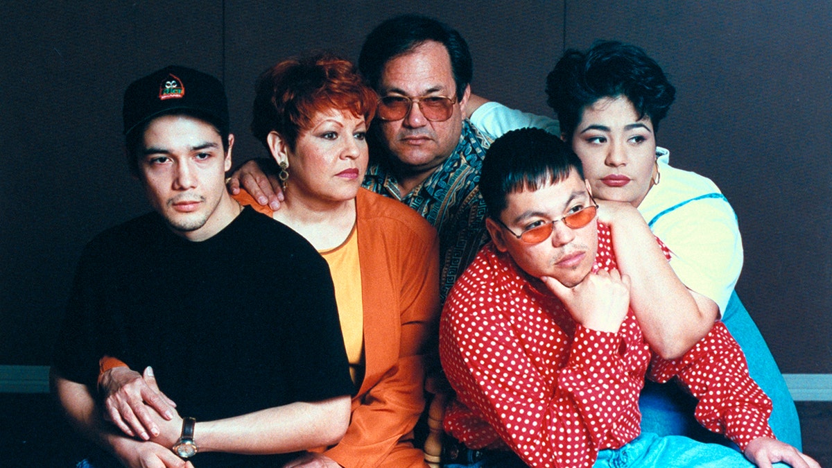 Selena's family huddled together