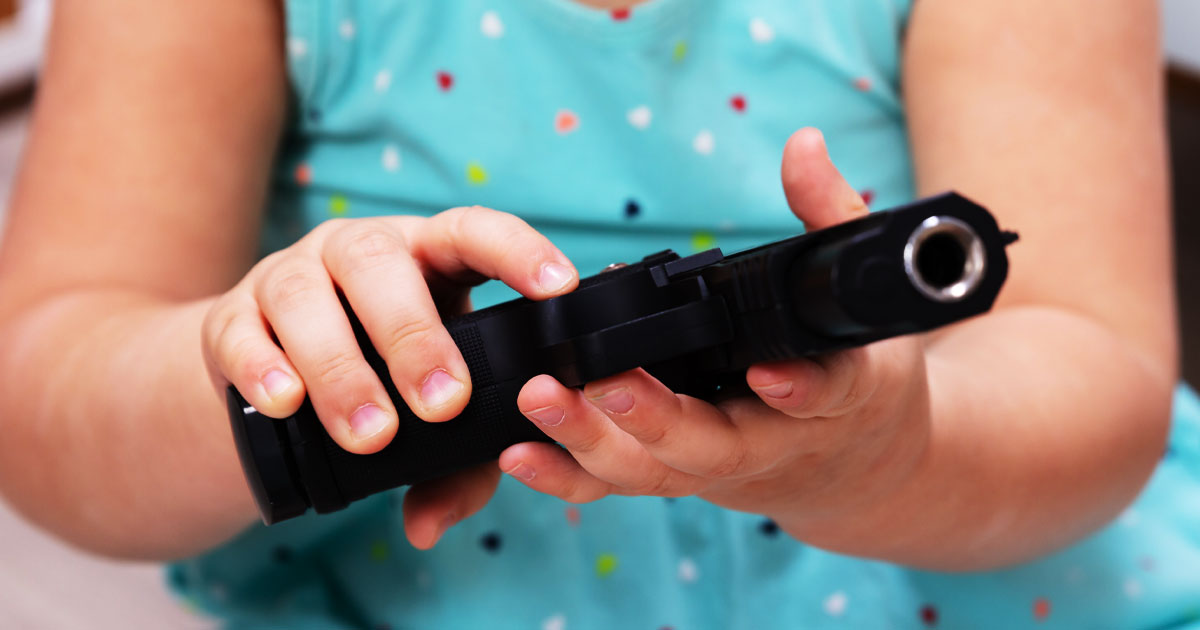 Man Arrested After Toddler Shoots Himself with Handgun Left on Bed