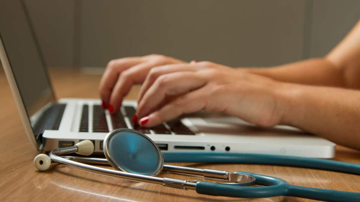healthcare worker typing