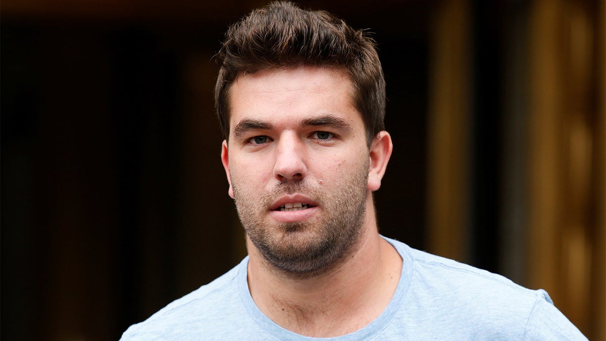 Billy McFarland walking out of court