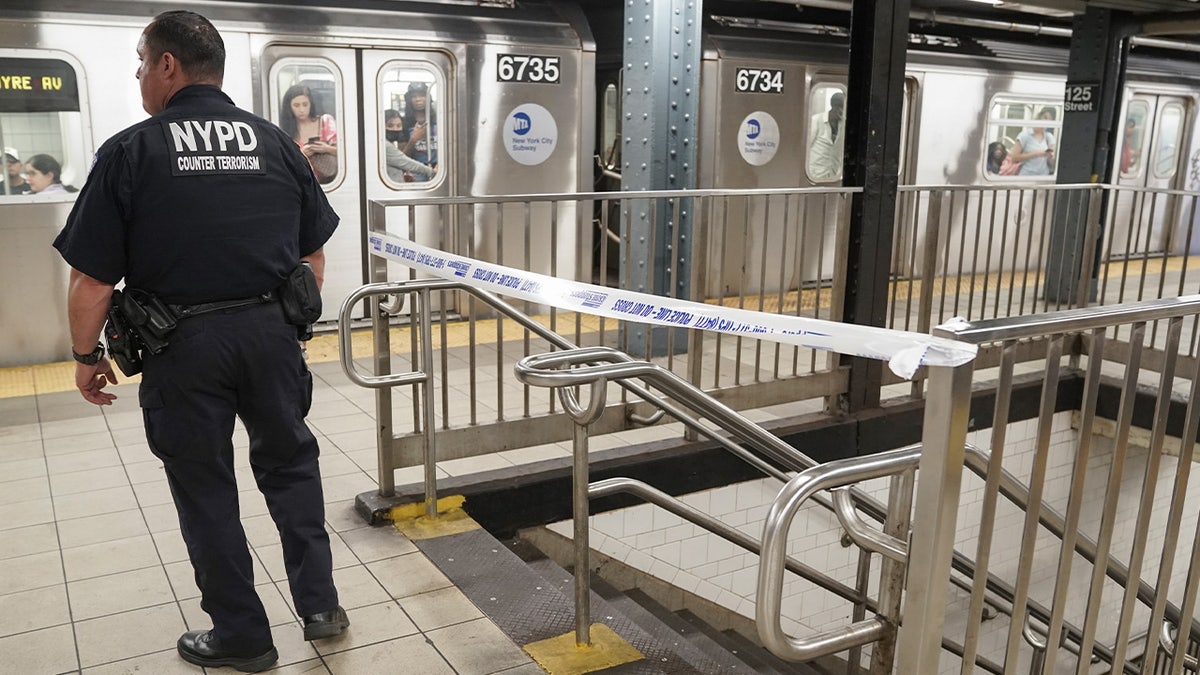 NYPD Counterterrorism officers standing in front of the NYC subway