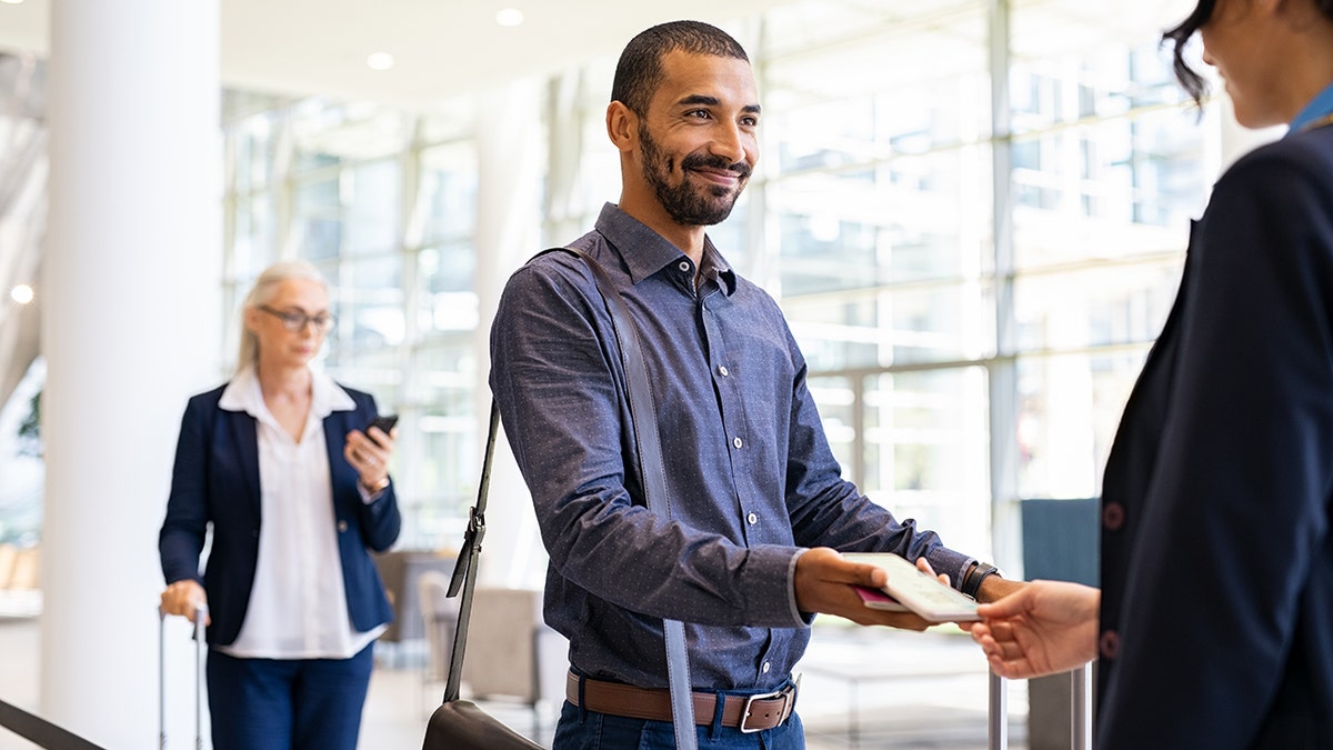 stock photo of man at boarding gate at airport