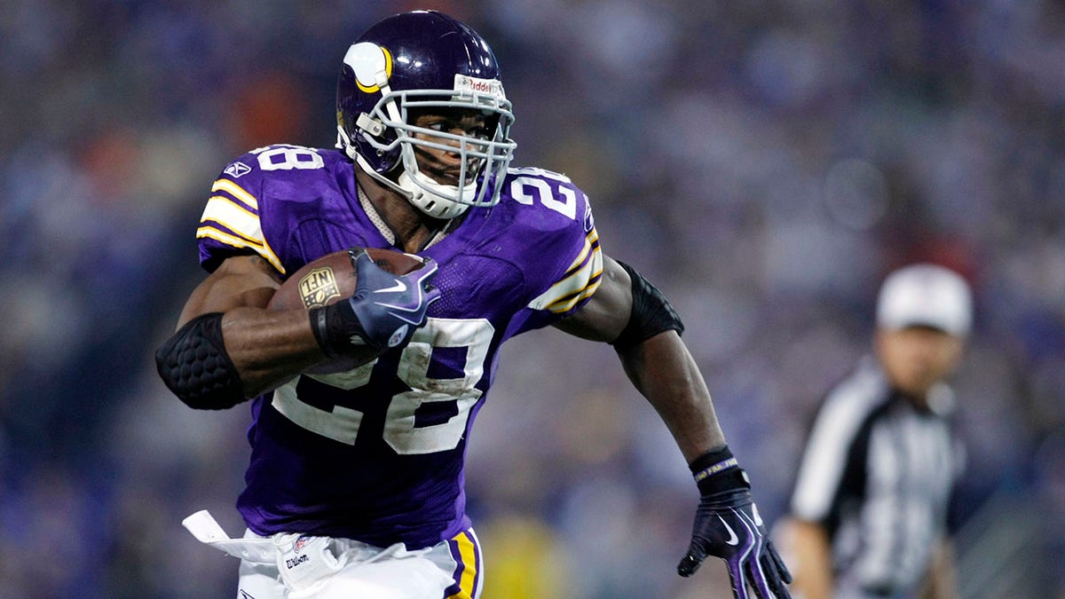 Adrian Peterson rushes