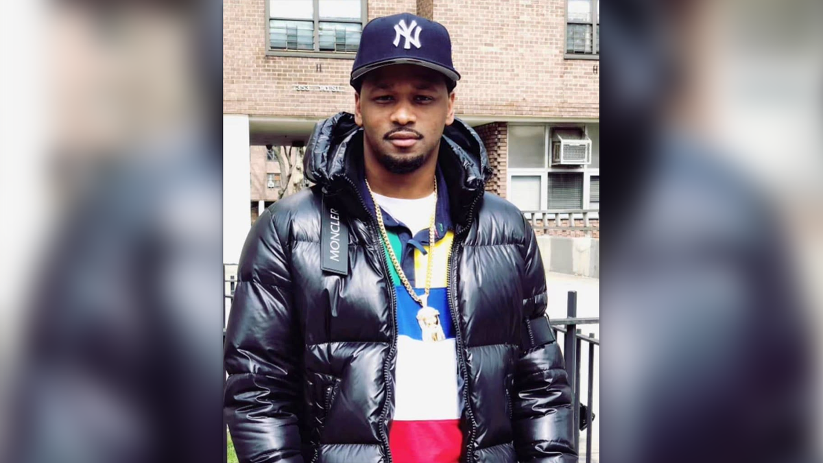 ray hodge in moncler jacket and yankees hat