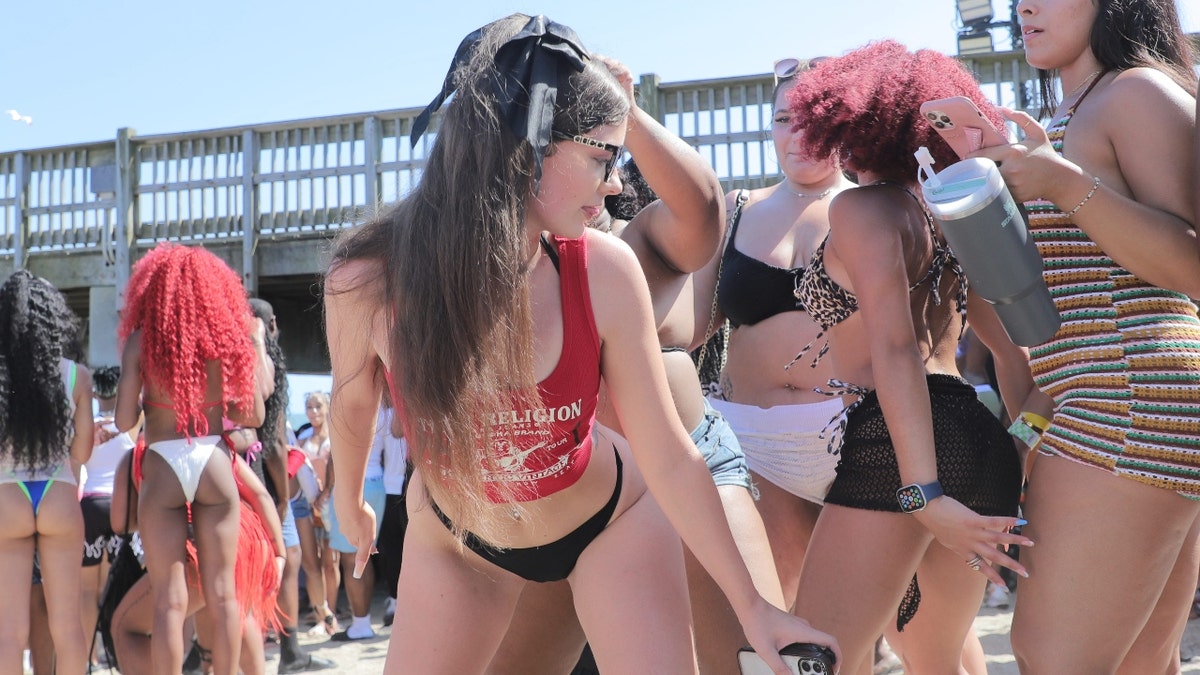 Spring breakers dance on Saturday, April 19, 2025 during Orange Crush on Tybee Island