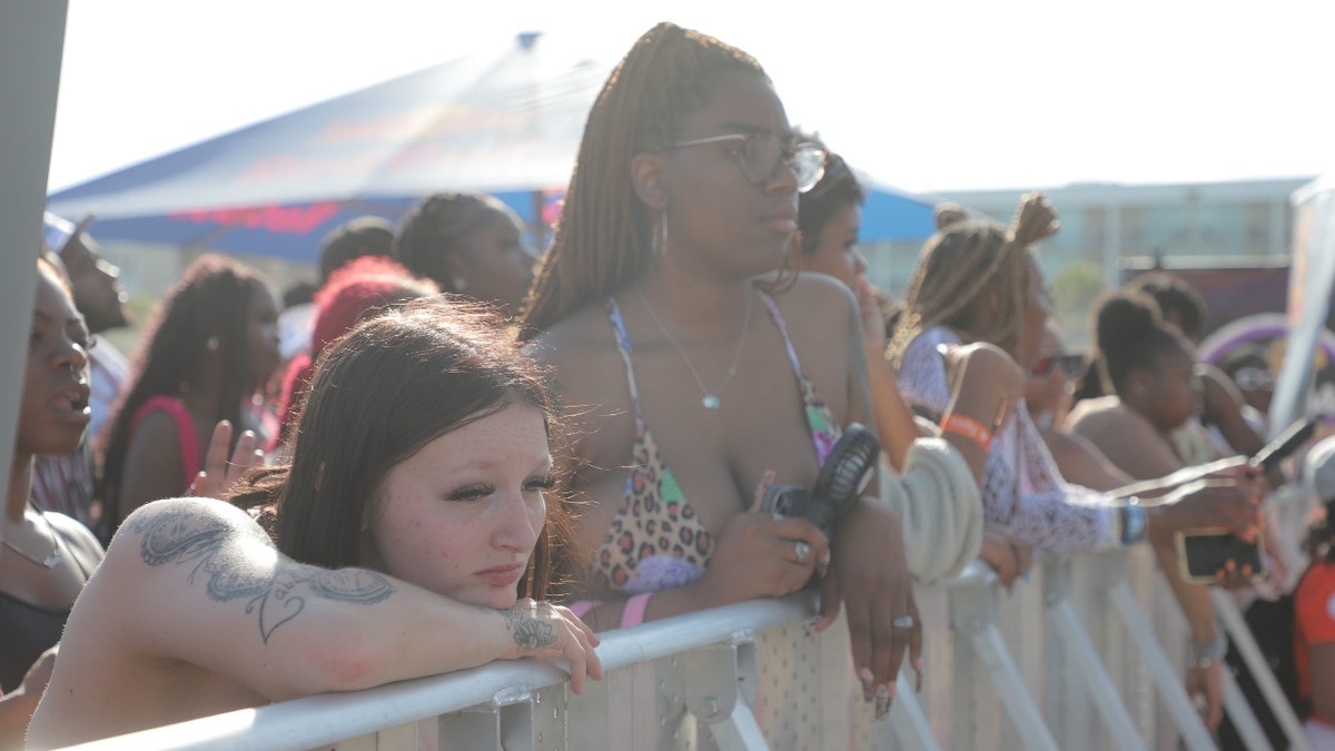 Partiers stand near the stage on Saturday, April 19, 2025 during Orange Crush on Tybee Island.