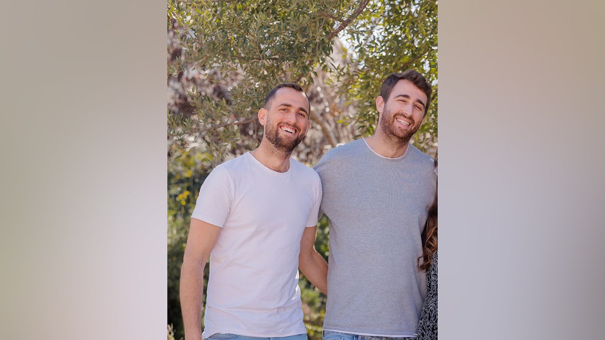 Avinatan Or (R) is being held hostage by Hamas terrorists.