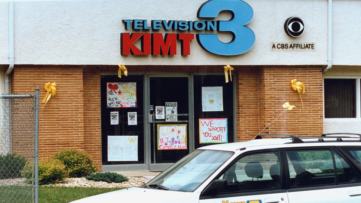 Flyers publicizing Jodi Huisentruit’s disappearance are seen outside of KIMT-TV