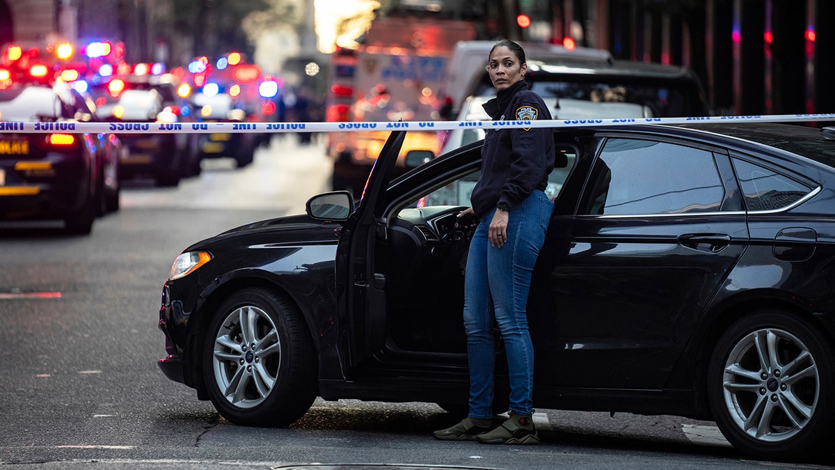 NYPD officer out of her car