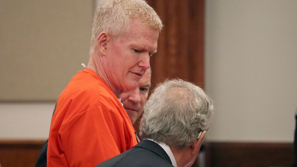 Convicted murderer Alex Murdaugh speaks with his defense attorney, Dick Harpootlian