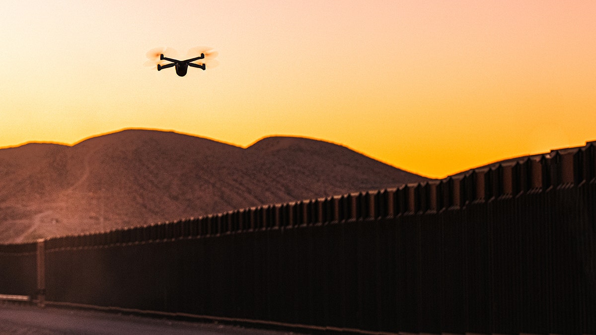 A drone flies over the border