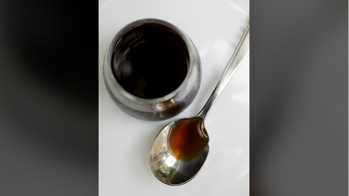 Mushroom ketchup in bowl, spoon