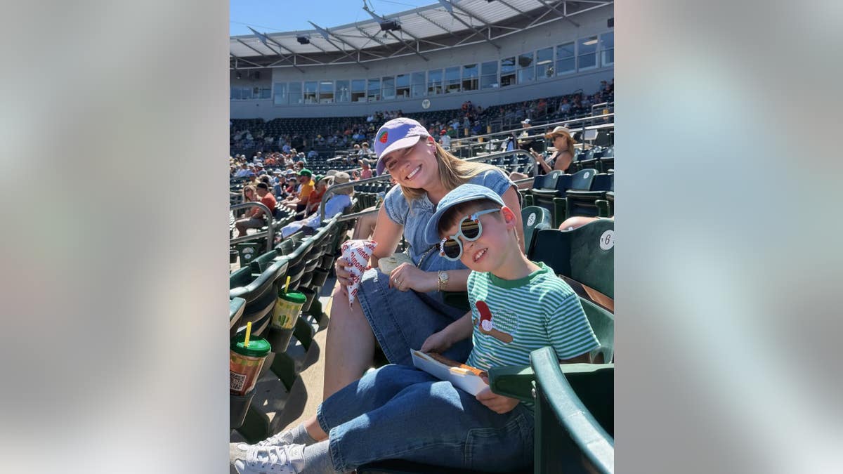 Emilie and Trigg Kiser at a baseball game