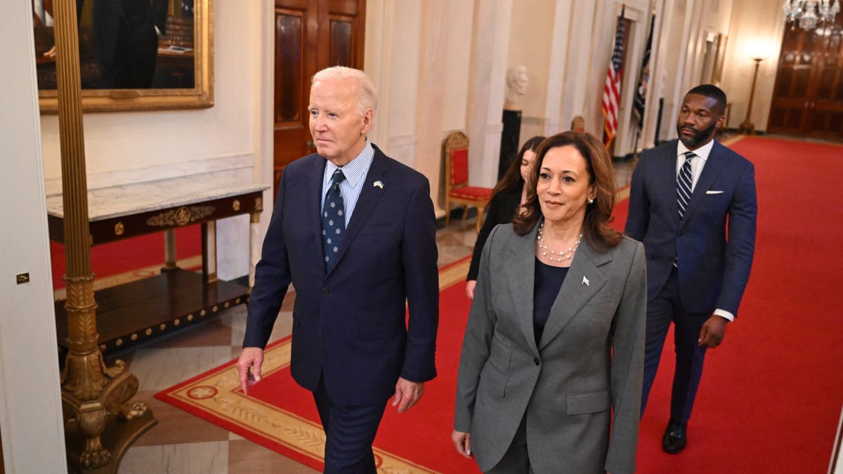 Joe Biden walking with Kamala Harris
