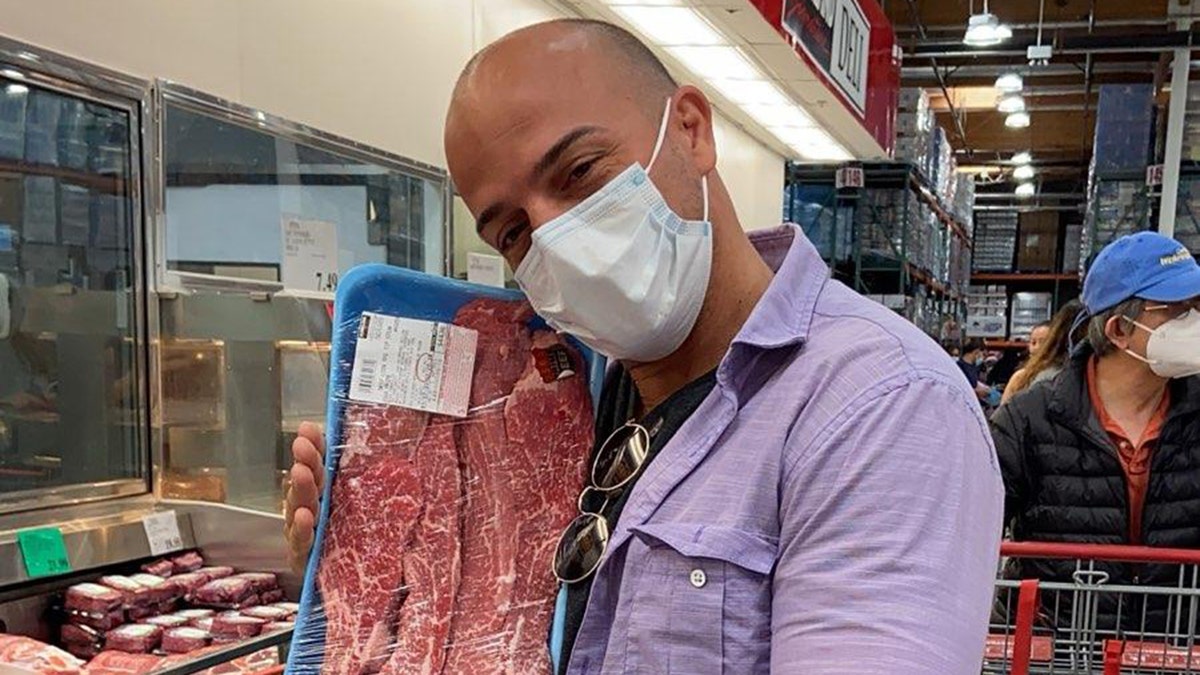 yoel diaz cuban immigrant looking at meat in Costco