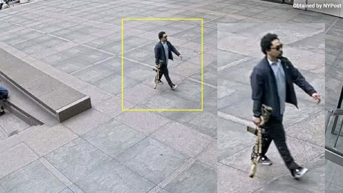 A gunman outside a midtown Manhattan building with a weapon.