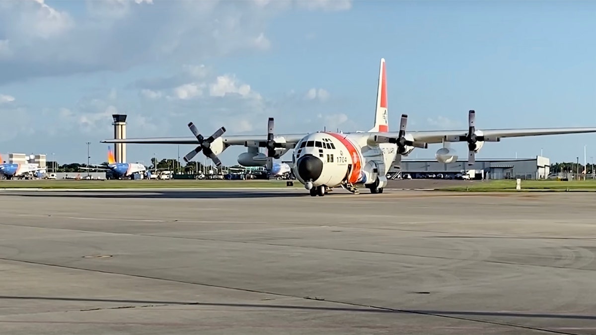 Coast Guard plane on tarmac at St. Pete-Clearwater International Airport