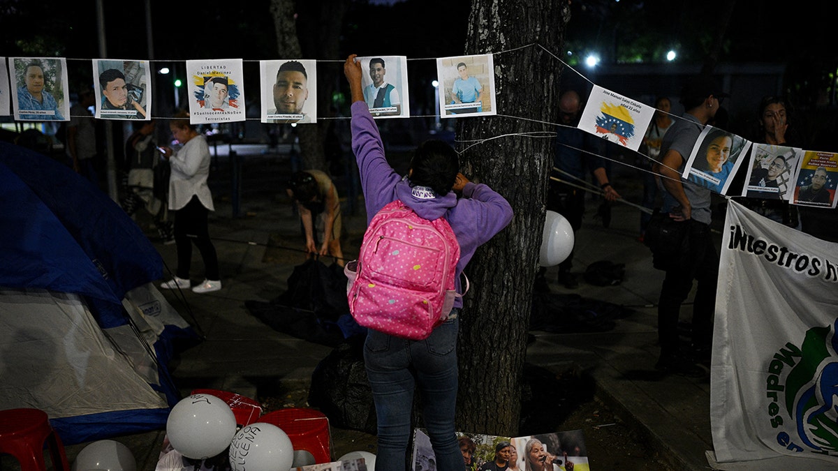 Venezuelans put up posters of missing protesters