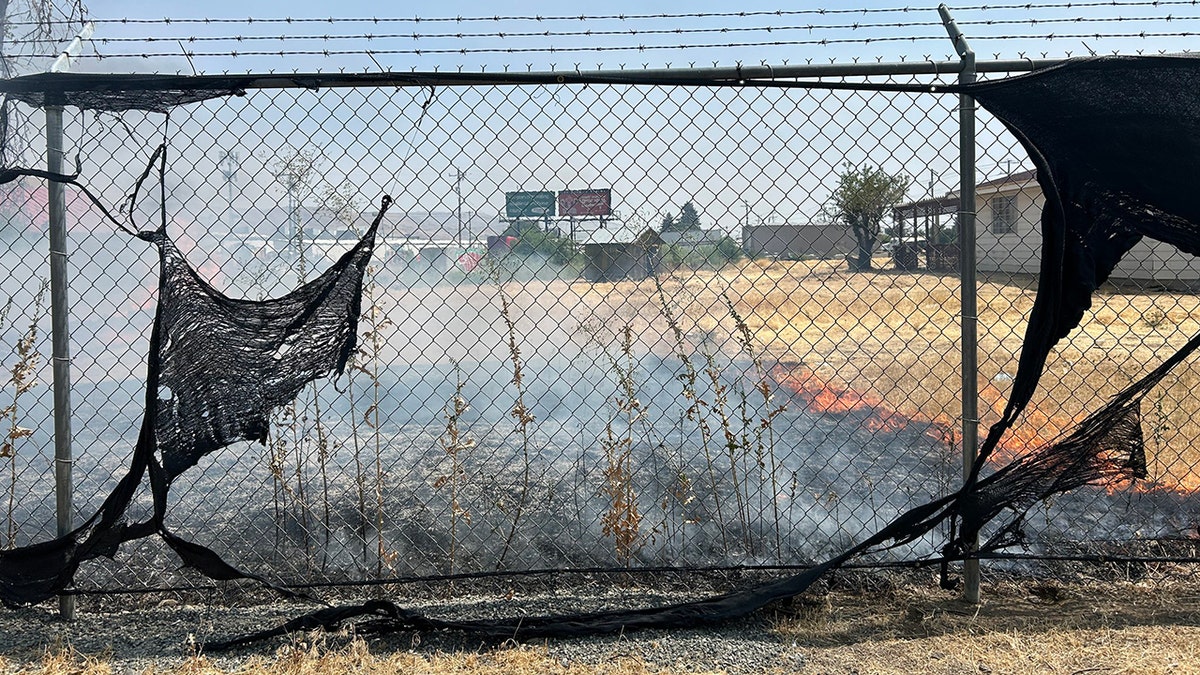 A fire burns at a building where ICE operates an office.