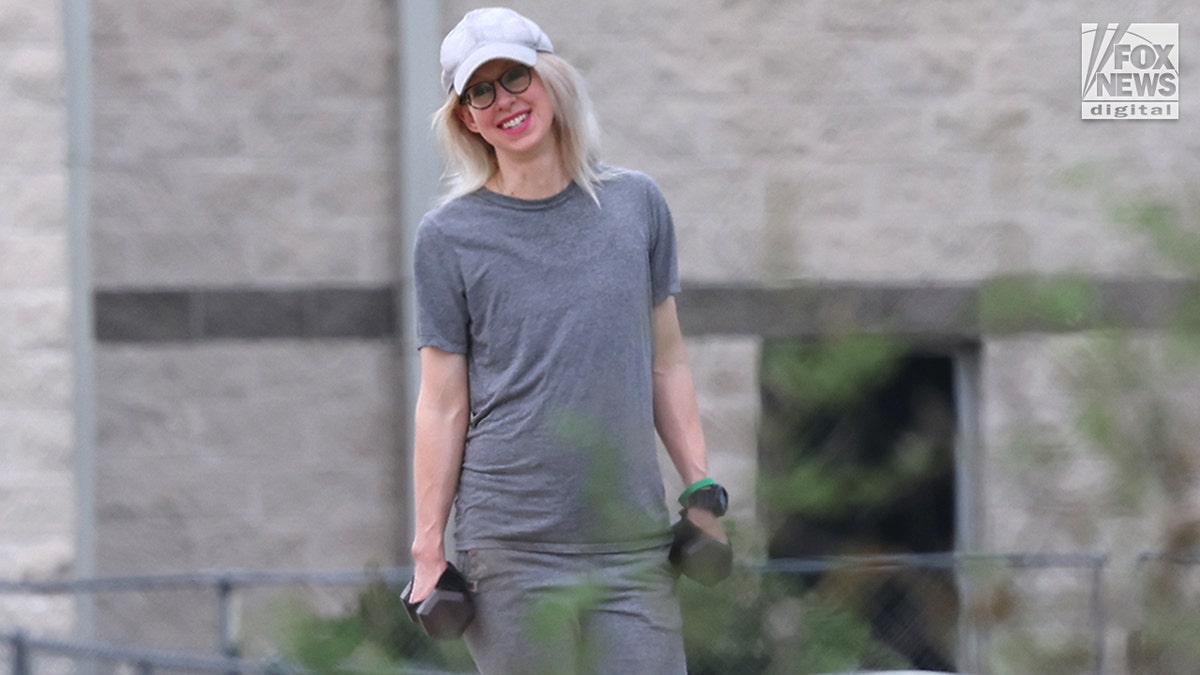 Elizabeth Holmes jogs in prison