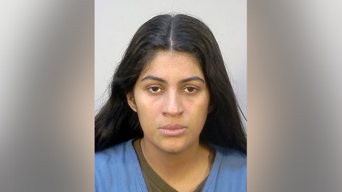 Noelia Saray Martinez-Avila in a blue jail jumsuit in her mugshot