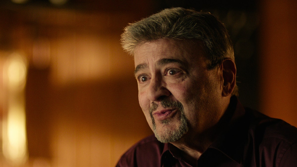 A close-up of John Comparetto appearing emotional.
