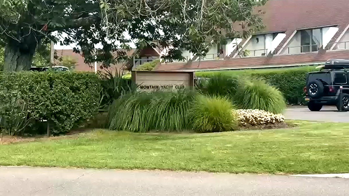 The Montauk Yacht Club sign behind plants