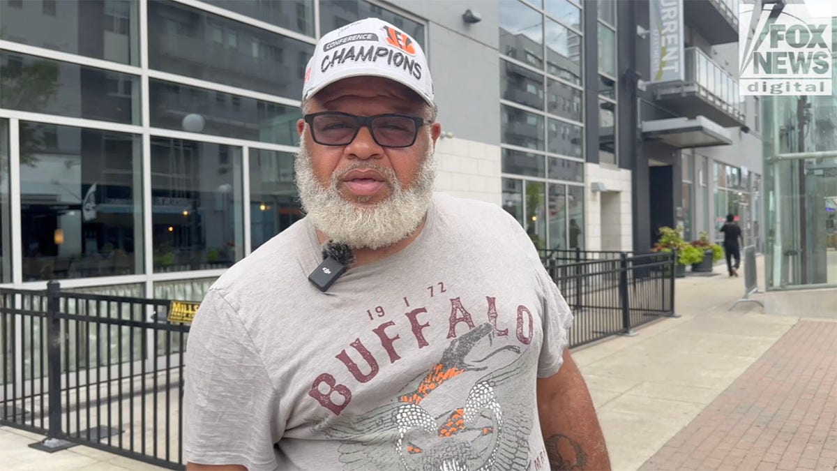 Robert Brown, a cincinnati resident, wearing a white hat and grey shirt