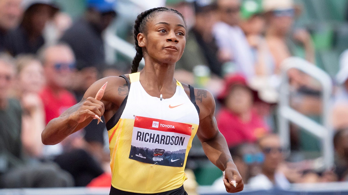 Sha'Carri Richardson looks up while running