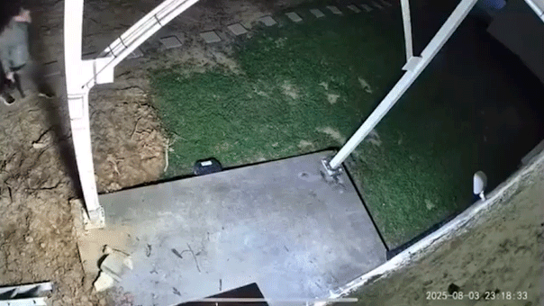 A man walking up to a door