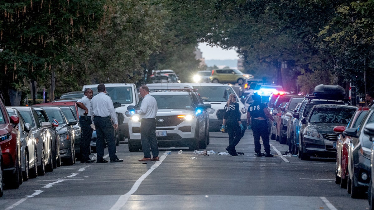 Metropolitan Police Department officers investigate a shooting