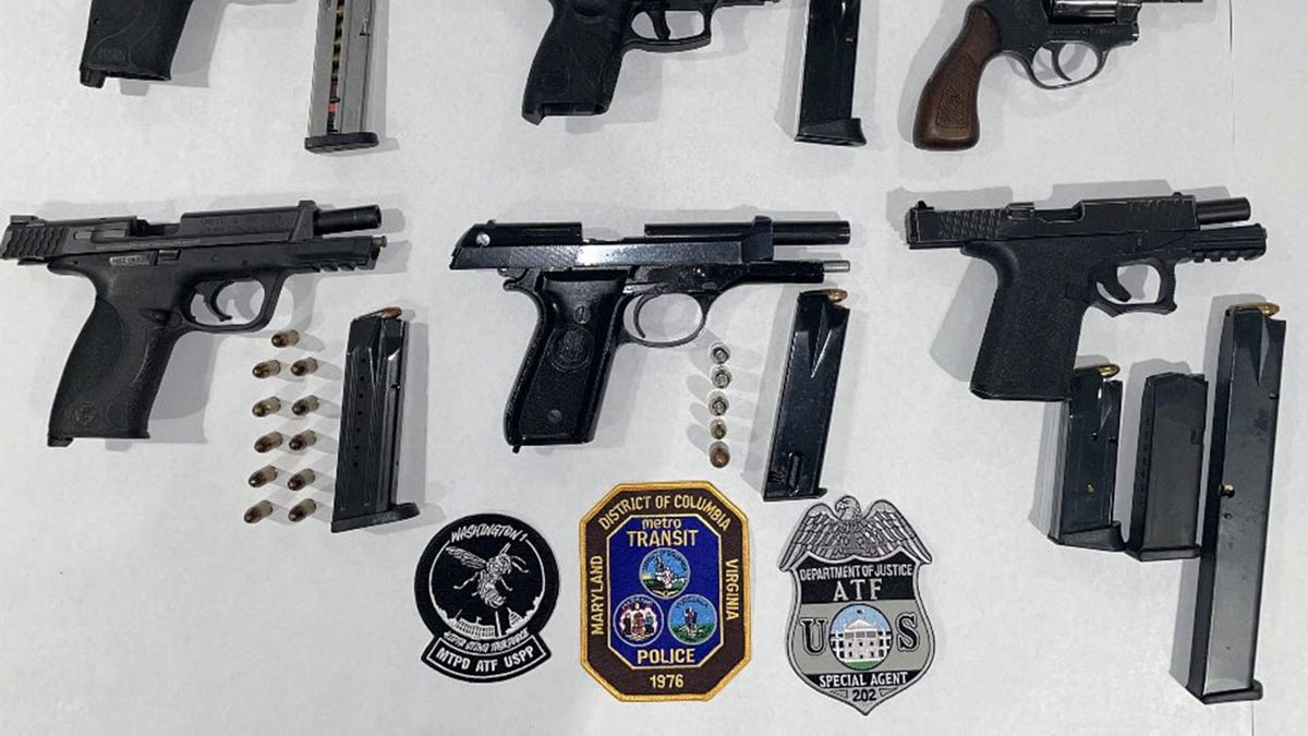 Firearms and ammunition pictured on a table