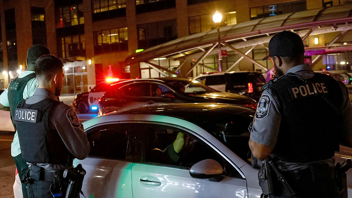 Officers standing near car in DC